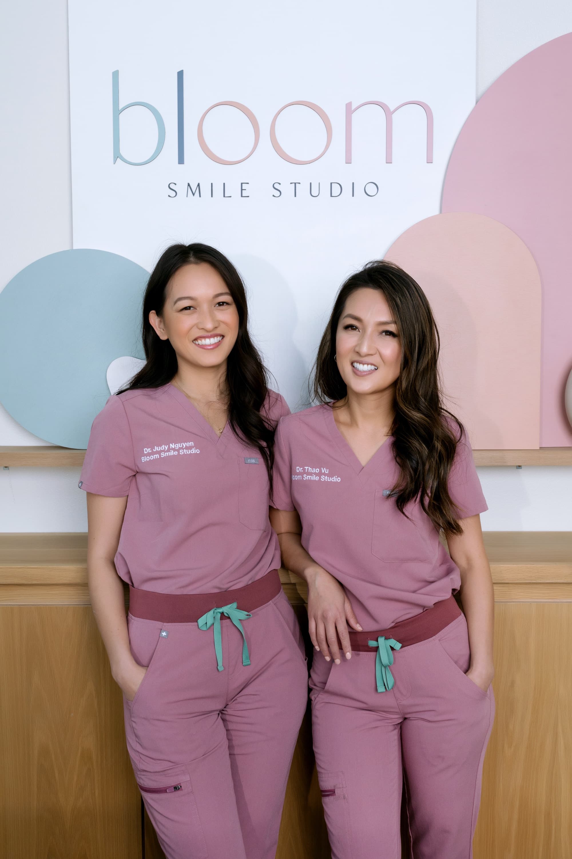 Dr. Thao Nguyen Vu and Dr. Judy Nguyen, board-certified orthodontists at Bloom Orthodontics & Bloom Smile Studio